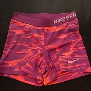 Nike Pro 3” compression shorts. Purple and coral.